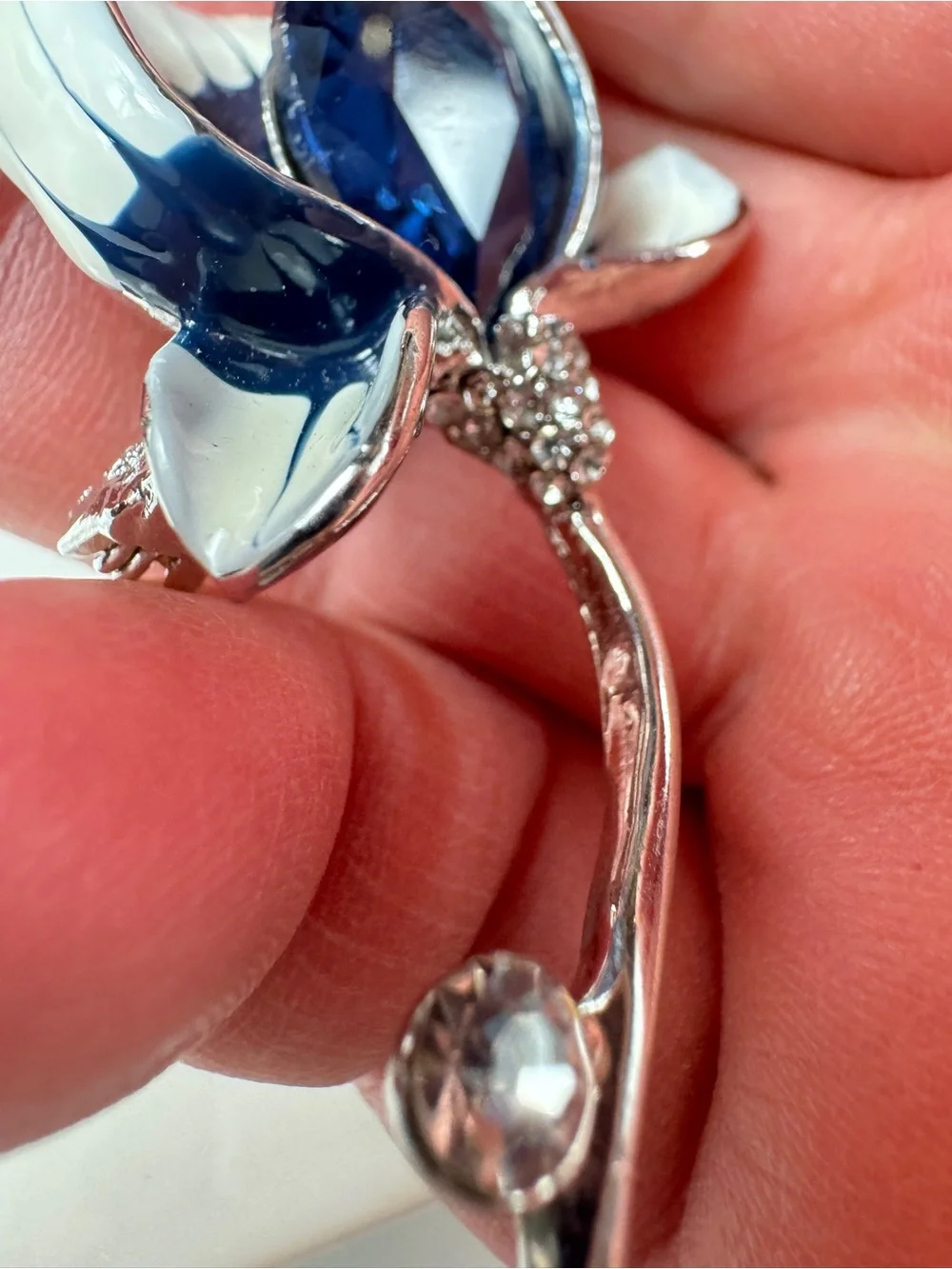 Silver Floral Brooch with Deep Blue Faceted Crystal